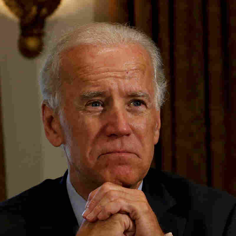 Vice President Joe Biden listens Friday as President Obama speaks at the White House.
