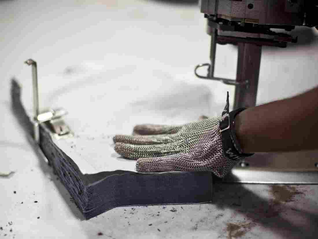 Cutting the sleeve of the Planet Money T-shirt