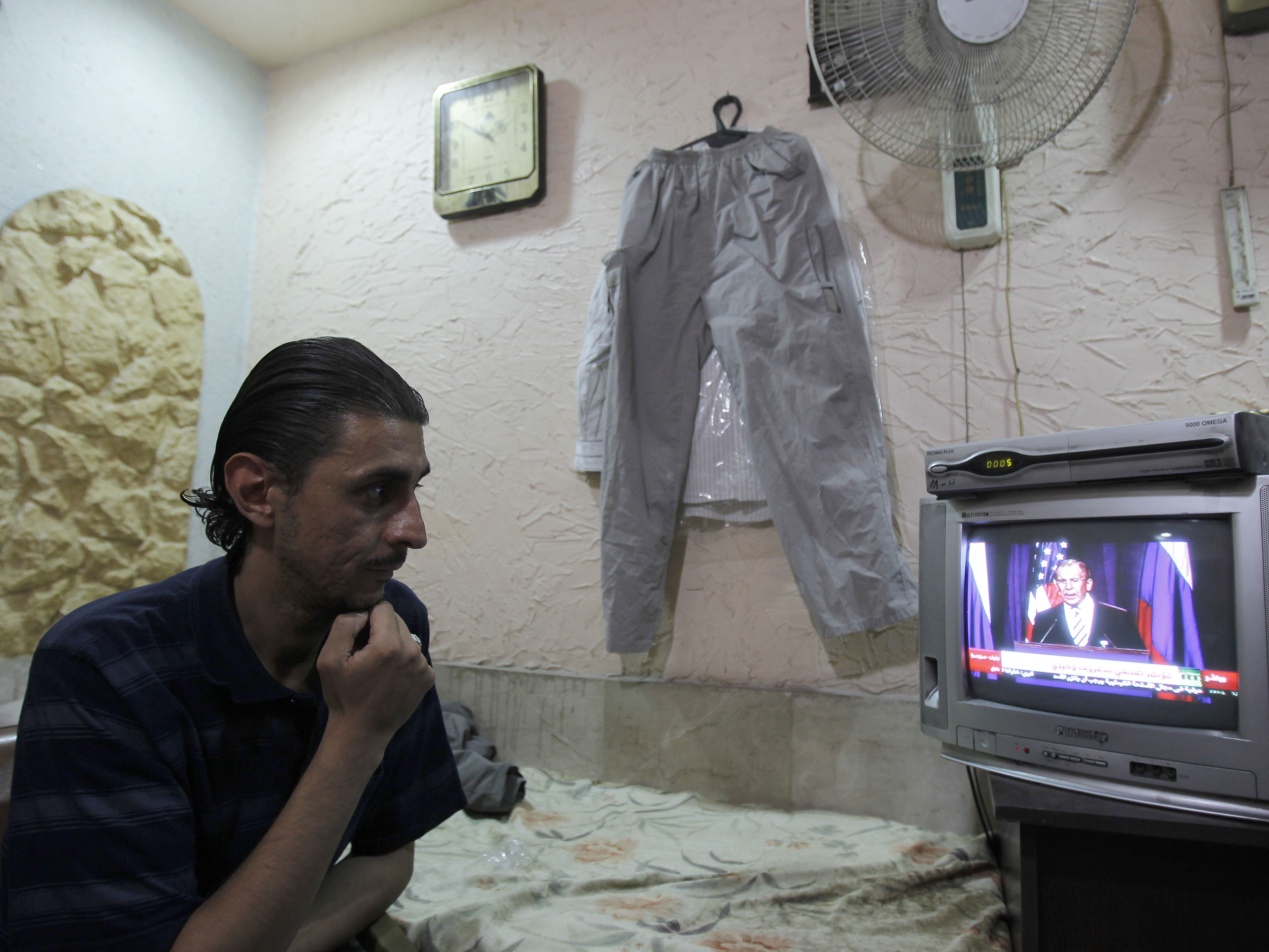 The Syrian regime calls a new deal on its chemical weapons a victory, in a reaction that came one day after the U.S. and Russia announced the plan. On Saturday, live coverage of the the deal drew the attention of a Damascus flower shop owner.