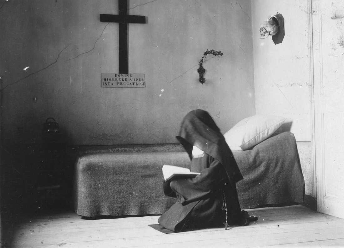 A Carmelite nun in her cell in France in 1904.
