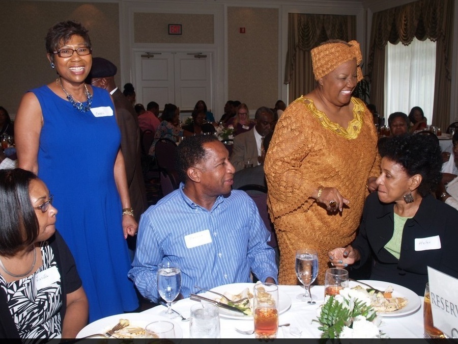 Carol Fowler (in blue dress) at the dinner her family turned into a charity event after her daughter's wedding was canceled. (Hosea Feed the Hungry, via Here & Now)