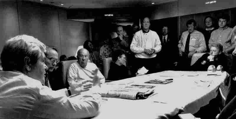 House Speaker Newt Gingrich speaks with President Clinton and others aboard Air Force One as the plane headed for Israel and the funeral of Prime Minister Yitzhak Rabin on Nov. 5. Gingrich has said that the president slighted him during the flight, which helped prompt the partial shutdown of the federal government.