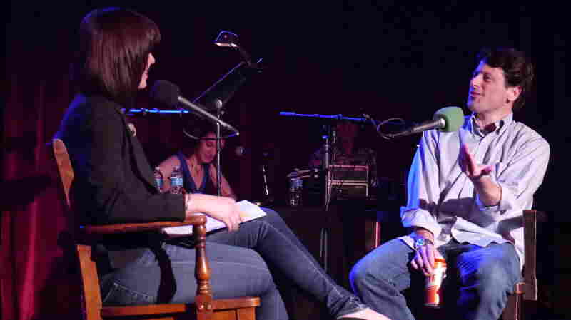 Very Important Puzzler Tom Ruprecht waxes poetic on writing phony oral histories with Ask Me Another host Ophira Eisenberg on stage at The Bell House in Brooklyn, NY.