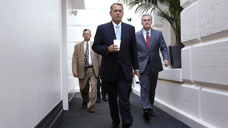 House Speaker John Boehner (center) and House Majority Whip Rep. Kevin McCarthy (right) arrive for a Republican caucus meeting at the U.S. Capitol. (Jonathan Ernst/Reuters/Landov)