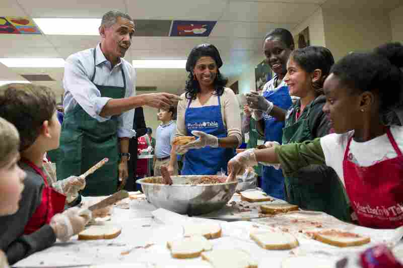 President Obama talks with children and adult volunteers at Martha's Table in Washington, D.C., on Monday. The nonprofit organization helps low-income and homeless families. Many of the volunteers over the past couple weeks were furloughed federal workers.