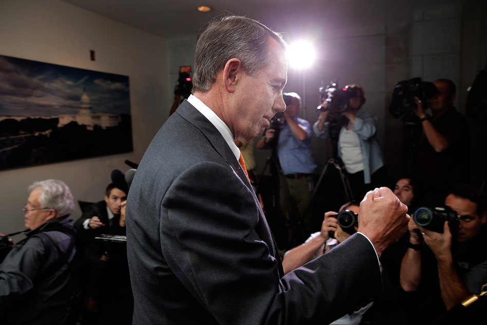 Speaker of the House John Boehner pumps his fist after leaving a meeting of House Republicans at the U.S. Capitol on Wednesday. (Win McNamee/Getty Images)