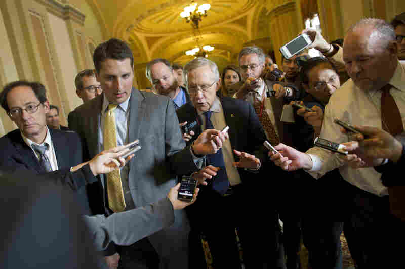 Senate Majority Leader Sen. Harry Reid, D-Nev., is surrounded by reporters after leaving the office of Senate Minority Leader Sen. Mitch McConnell, R-Ky., on Capitol Hill on Monday.