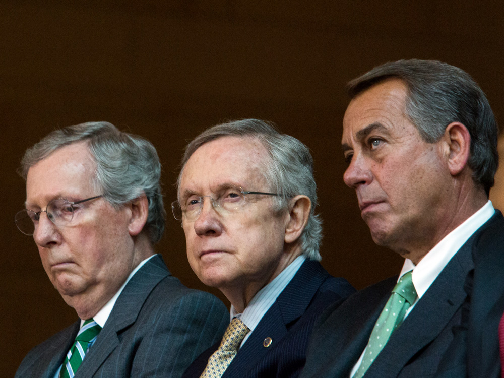 Senate Minority Leader Mitch McConnell (left), Senate Majority Leader Harry Reid (center), and Speaker of the House John Boehner are three key lawmakers in the government shut down and debt ceiling crisis. (Getty Images)