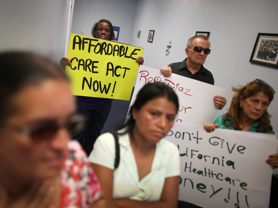 Protesters fill the Miami office of state Rep. Manny Diaz Jr. on Sept. 20 to protest his stance against expansion of health coverage in Florida. (Joe Raedle/Getty Images)