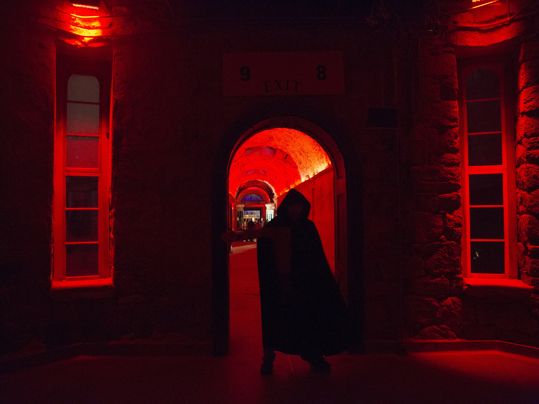 An actor looms in the prison's rotunda during the haunt. &quot;Terror Behind The Walls&quot; sets are constructed in a way where it does not damage the prison's structure and can quickly be removed. (Emily Bogle)