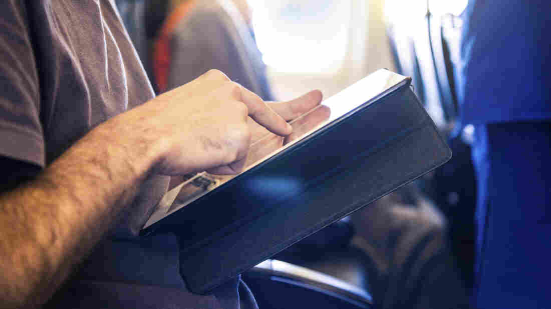 The FAA says airline passengers can safely use most personal electronic devices "gate-to-gate." But forget about making cellphone calls.