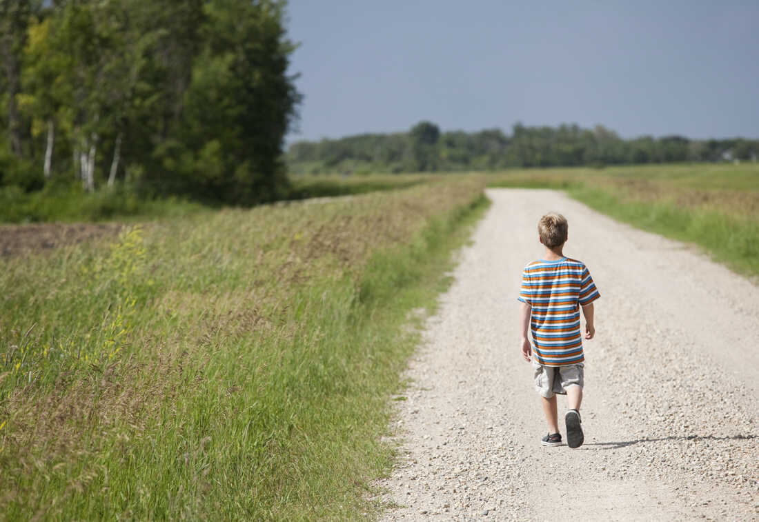 boy walking alone