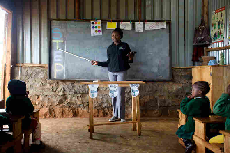 A teacher at the Bridge International Academy school in Kinoo, near Nairobi, Kenya, gives a lesson to young students. Bridge, a private, for-profit company, has set up more than 200 schools in the country.