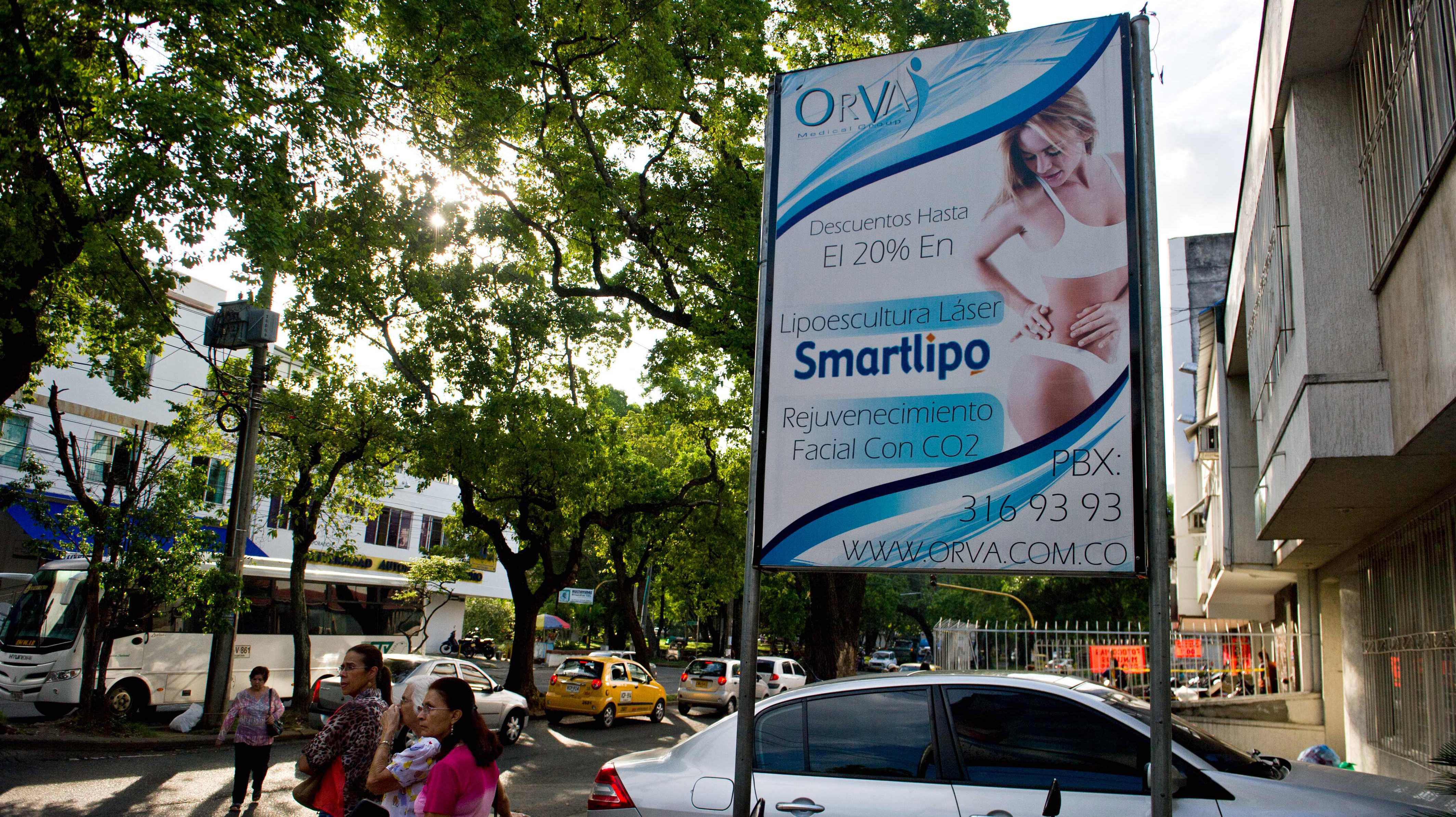 A billboard announces discounts on cosmetic treatments in a street of Cali, Valle del Cauca department, Colombia. In recent years the country has been building facilities specifically designed for medical tourists. (AFP/Getty Images)