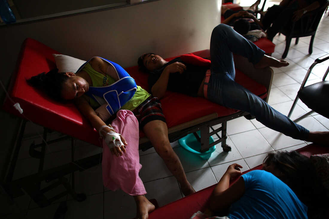 Patients lay in a makeshift waiting area in the halls of the Divine Word Hospital in Tacloban, Philippines, on Saturday.