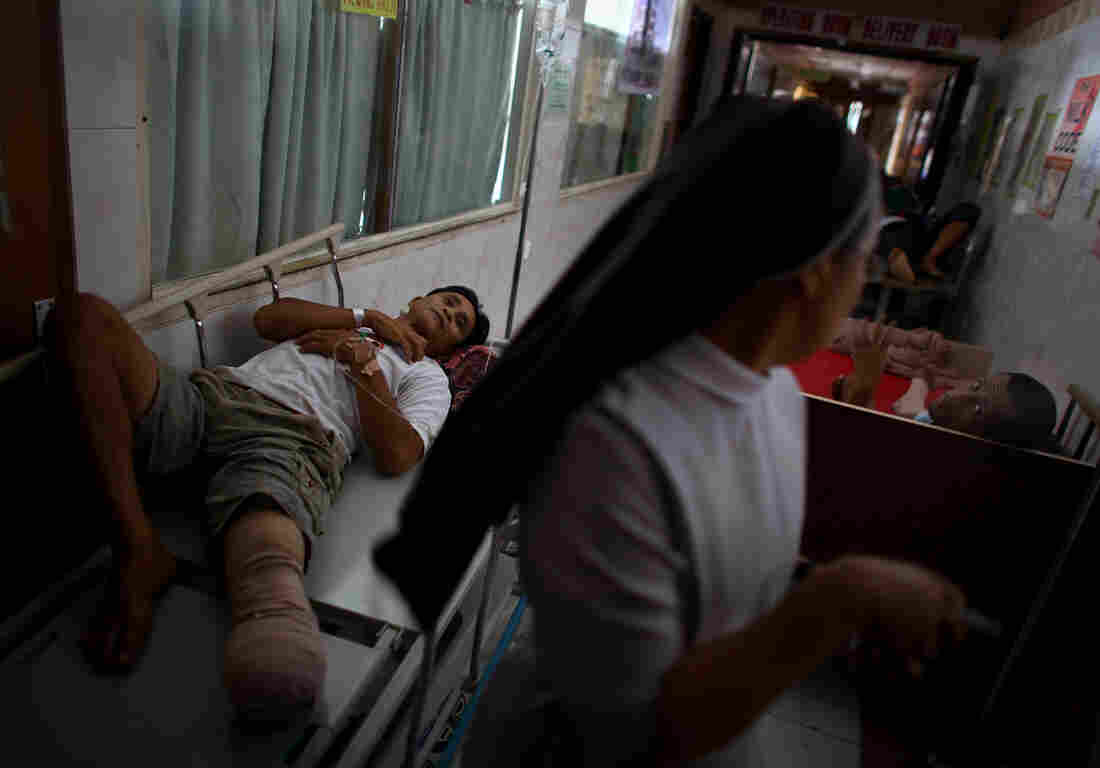 Injured patients line the halls of the Divine Word Hospital in Tacloban, Philippines, on Saturday.