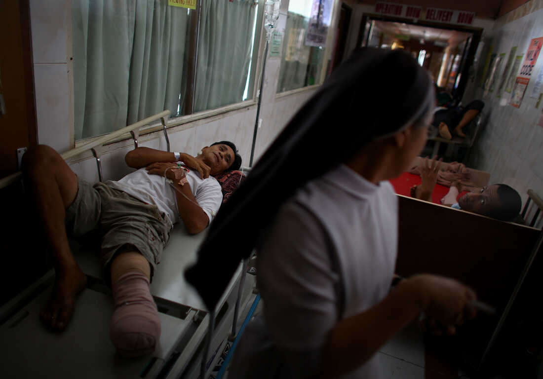 Injured patients line the halls of the Divine Word Hospital in Tacloban, Philippines, on Saturday.