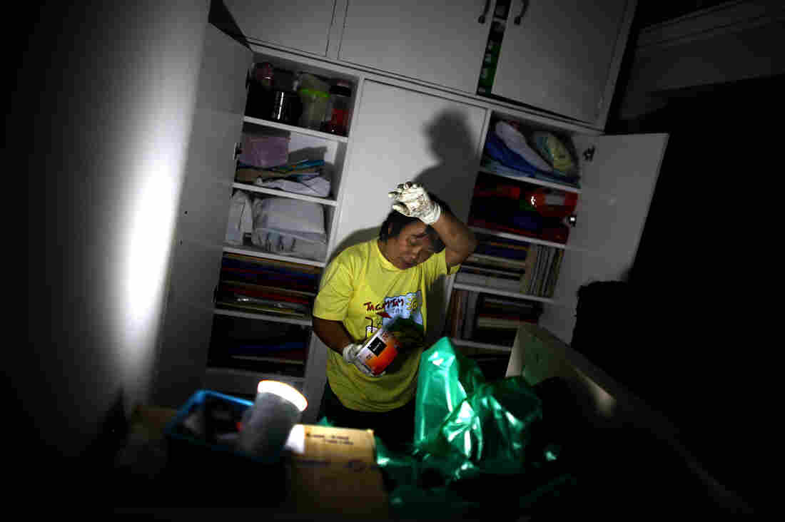 A nurse fights the heat and humidity in the lab of the Divine Word Hospital in Tacloban, Philippines, on Saturday.