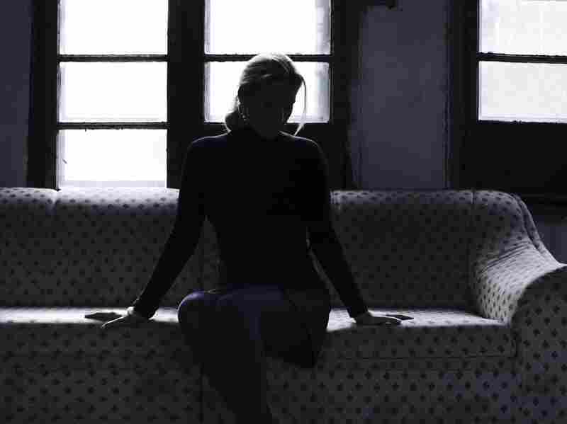 A woman sitting alone.
