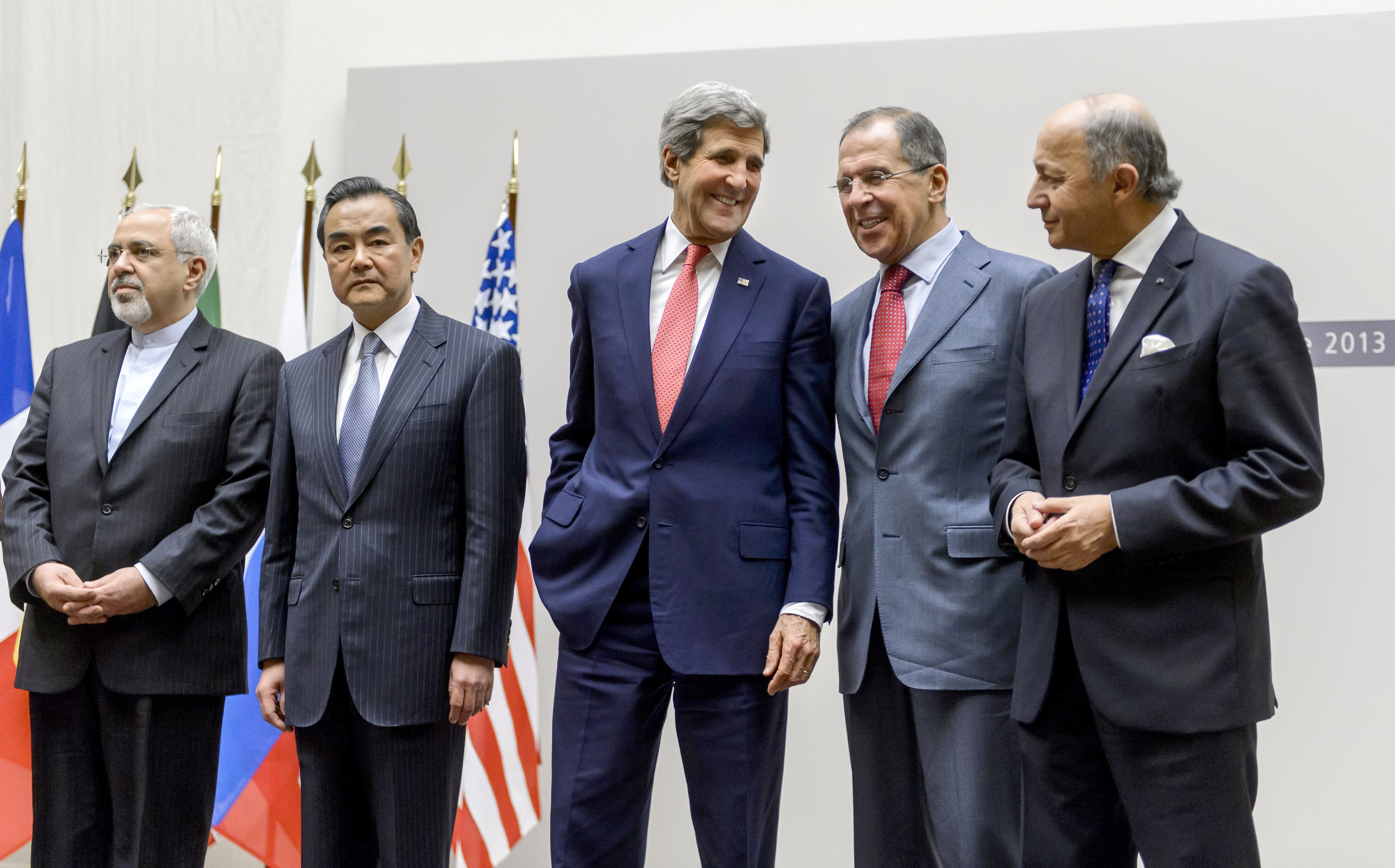 Iranian Foreign Minister Mohammad Javad Zarif, Chinese Foreign Minister Wang Yi, U.S. Secretary of State John Kerry, Russian Foreign Minister Sergei Lavrov and French Foreign Minister Laurent Fabius react during a statement early Sunday in Geneva. (AFP/Getty Images)