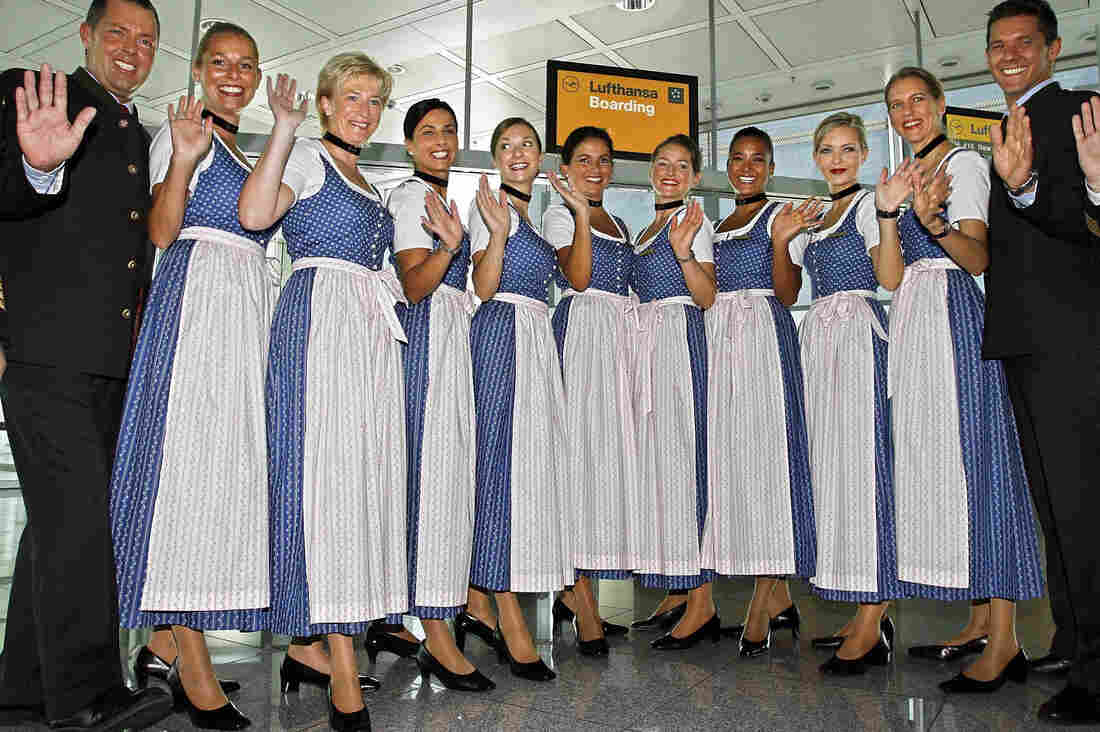 Crew members of German airline Lufthansa pose in traditional Bavarian dresses at the Munich airport in southern Germany.