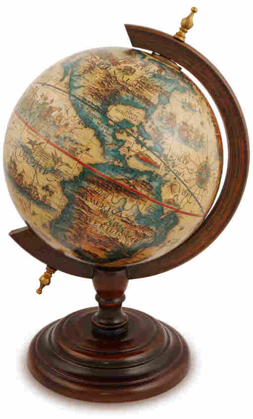 Antique globe from a red wood.