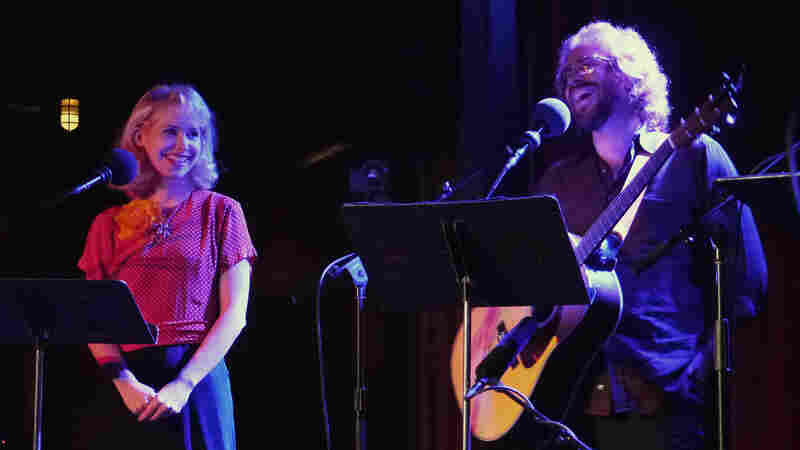 Singer-songwriter Nellie McKay (left) and house musician Jonathan Coulton ham it up at The Bell House in Brooklyn, NY, with a rendition of the tune "Get Along Little Doggies."
