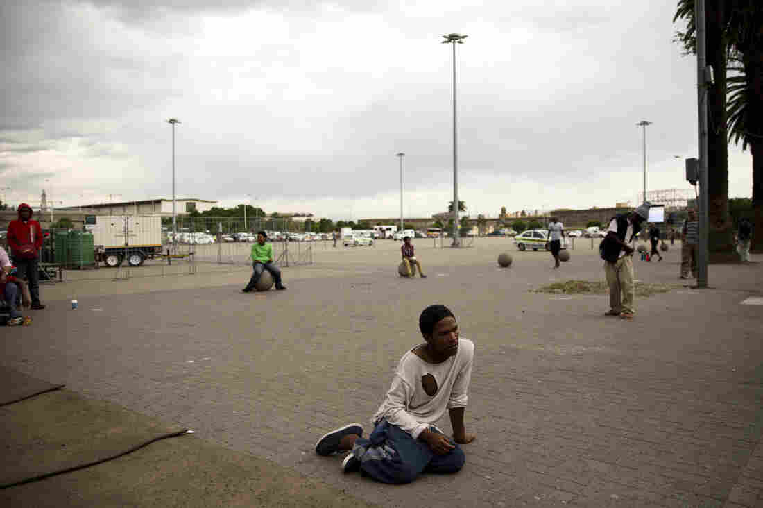 Here I a good place to talk about the difference between how people in Johannesburg are mourning to here. In Cape Town the emotion has a more somber tone. While people are slowly going to various places in the city to sign a condolence book, or leave flowers – there is none of the mass groups of people that have engulfed the area.