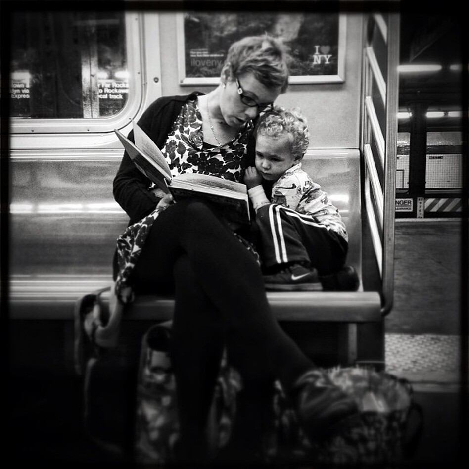 <strong>Original caption via Instagram:</strong> #pscommute 5:15 PM on the C Train. 34th Street, Penn Station back home to Fort Greene, Brooklyn. Giving the gift of reading. A magical moment between mother and son. It may seem like just another subway ride, but with a book and an imagination, the adventures are limitless. (Jabali Sawicki/@jsawicki1/Instagram)