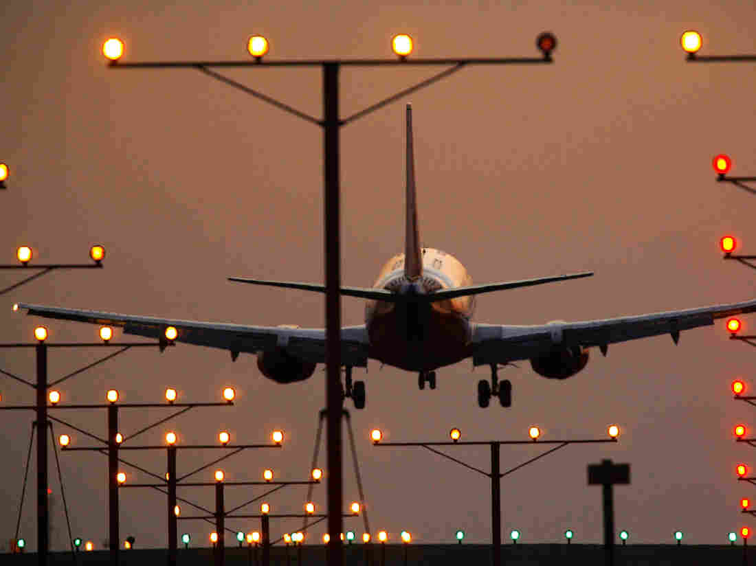 A jet comes in for landing at Los Angeles International Airport