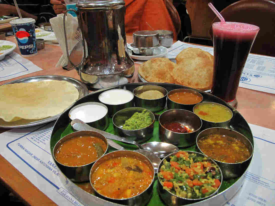 Date for two: Dinner includes a South Indian thali platter that typically includes dal, vegetables, roti, rice, curd (yogurt) and chutney served in small bowls, or katori, on a round tray. Throw in an order of delicious samosas.