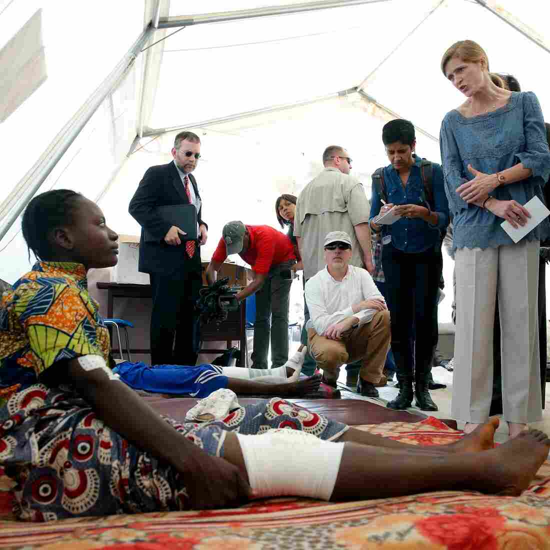 U.S. Ambassador to the Unitied Nations Samantha Power (right) listens to Lucy Mandazuto at a community hospital in Bangui, Central African Republic, on Thursday. Mandazuto was wounded in sectarian violence. U.S. Ambassador to the Unitied Nations Samantha Power (right) listens to Lucy Mandazuto at a community hospital in Bangui, Central African Republic, on Thursday. Mandazuto was wounded in sectarian violence.