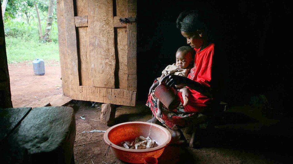 Almaz Acha sits with her baby Alentse at her home in the rural community of Sadoye, in southern Ethiopia. Families in rural communities, like this one, have benefited from Ethiopia's health extension program. (Julien Behal/PA Photos /Landov)