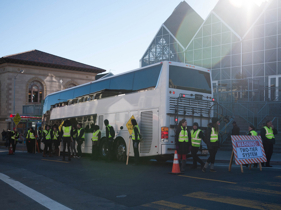 Protesters in San Francisco block a Google bus, which shuttles employees from the city to its location in Silicon Valley. (cjmartin/Flickr)
