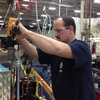 Paul Gibson works on the Geo-Spring hybrid water heater at General Electric's Louisville, Ky., plant. For many years, GE outsourced manufacturing of the water heater to a company in China. But in 2009, it decided to bring production back to the U.S.