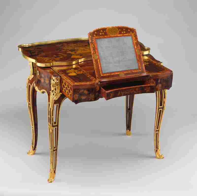 This French mechanical table was intended for Madame de Pompadour. The designs depict her many interests, including gardening, painting, music and architecture.