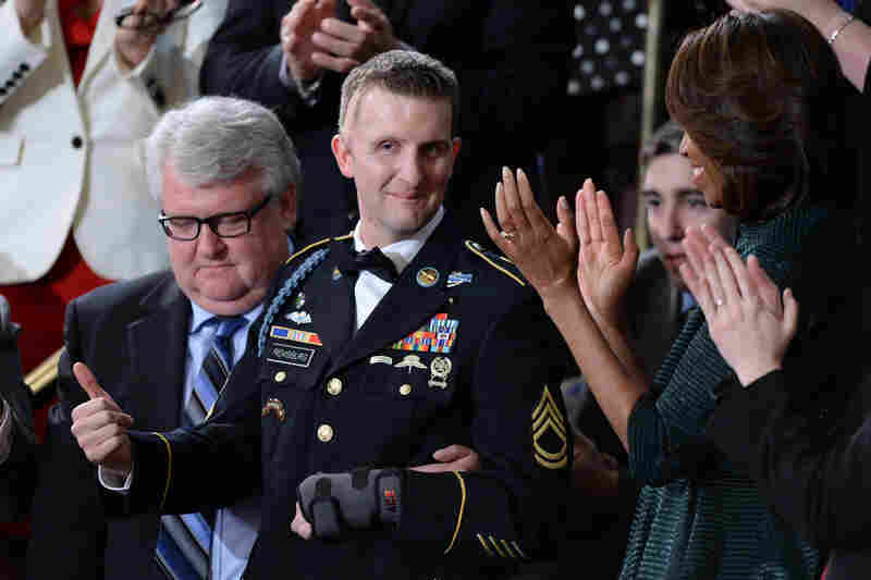 Army Ranger Cory Remsburg, who was wounded in Afghanistan, gives the thumbs up as Obama speaks about him in the final portion of the address.