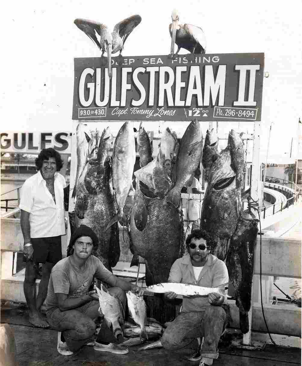 Even prize fish are smaller than the people who caught them in this photo from sometime between 1965 and 1979.