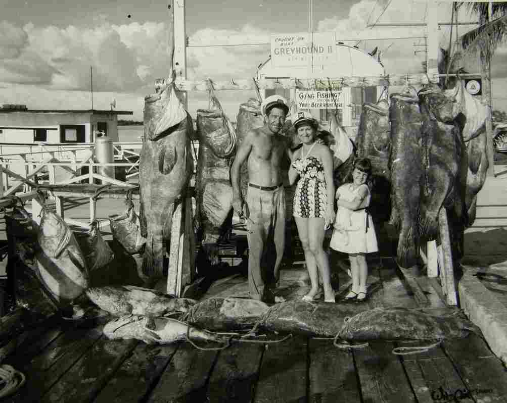 A proud fishing family in 1958 stands before several prizewinning fish much bigger than a human 5-year-old.