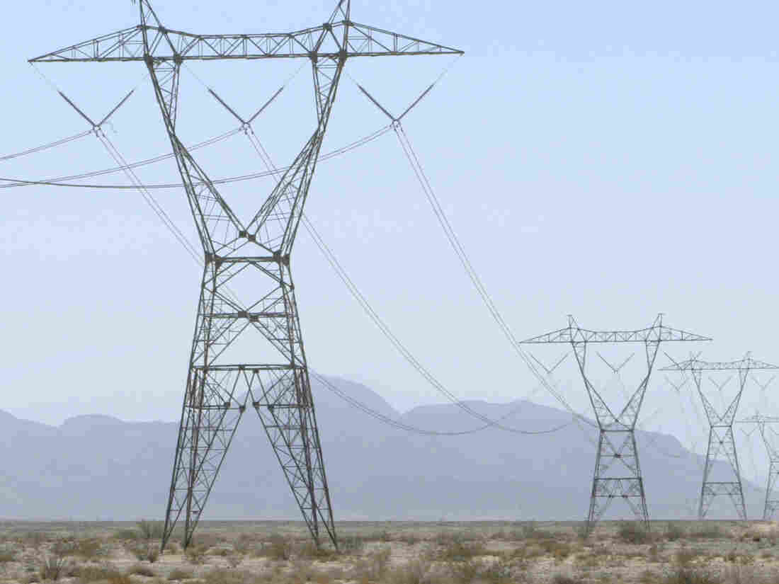 High voltage power lines cross through the California desert west of El Centro.