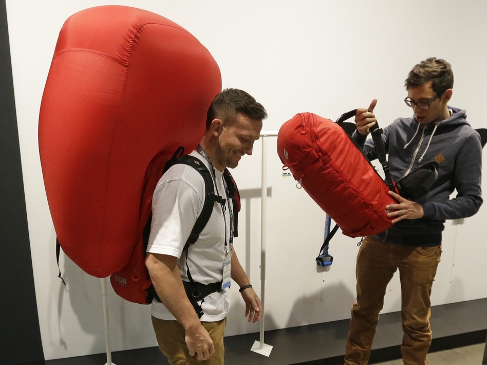 Derick Noffsinger models a deployed avalanche air bag pack made by Black Diamond at an industry market in Salt Lake City last month.