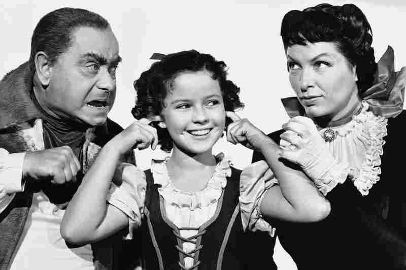 Temple with Eddie Collins and Gale Sondergaard from a scene of the 1940 movie The Blue Bird.