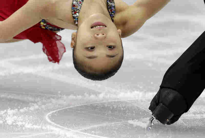 Narumi Takahashi and Ryuichi Kihara of Japan compete in the pairs short program figure skating competition at the Iceberg Skating Palace during the 2014 Winter Olympics on Tuesday in Sochi, Russia.
