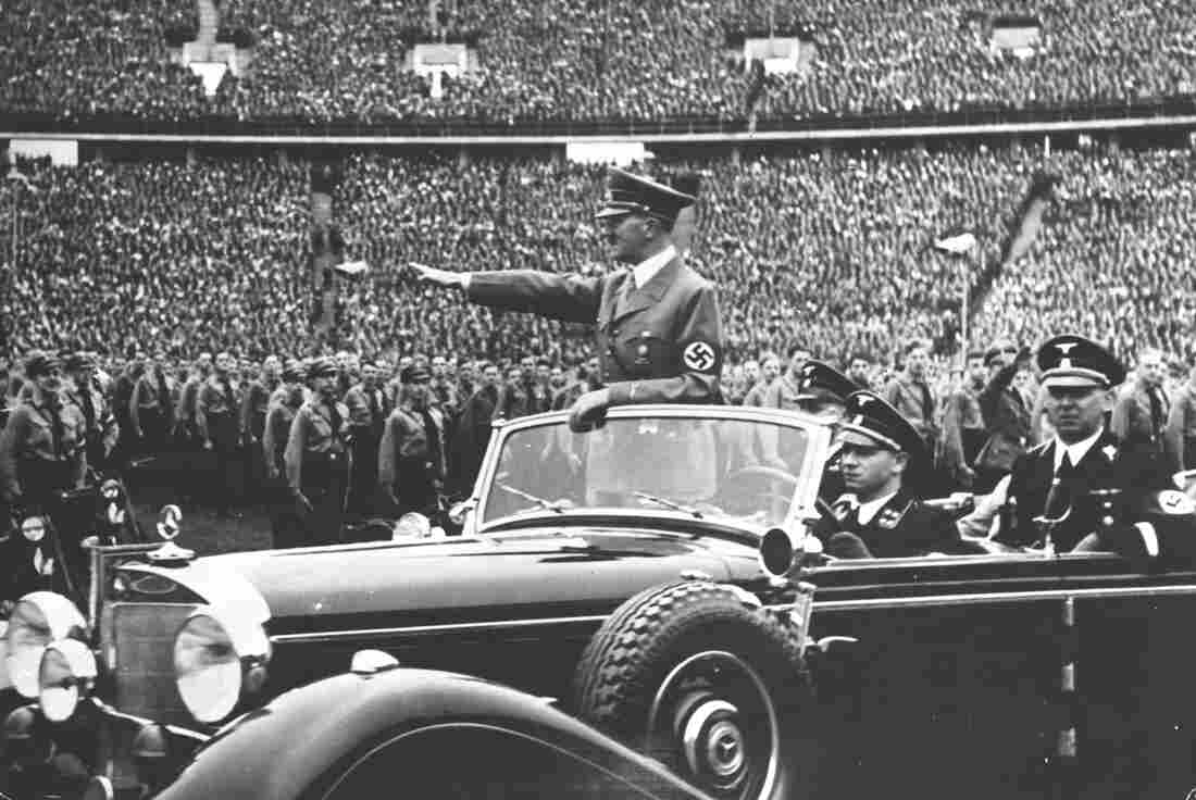 Adolf Hitler salutes to a crowd of soldiers at a Nazi rally in 1938. Years later, in the final months of World War II, the United States undertook an enormous effort to attract Nazi scientists.