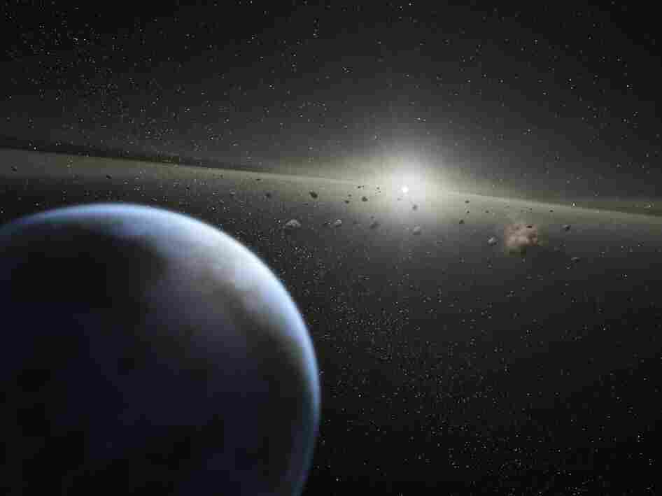 A NASA artist's illustration of an asteroid belt around a star that's "the same age and size as our Sun."