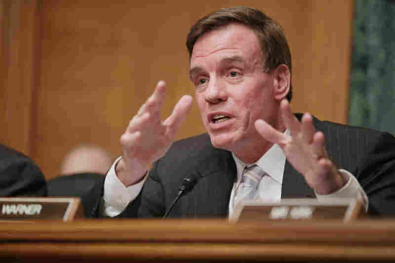 Sen. Mark Warner delivers opening remarks during a hearing on virtual currency on Capitol Hill in November 2013.