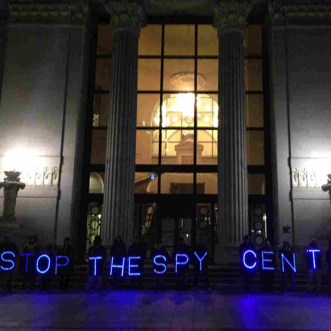 Protesters line up outside City Hall in Oakland, Calif., to demonstrate against the Domain Awareness Center, a data integration system being built by the city and the Port of Oakland.