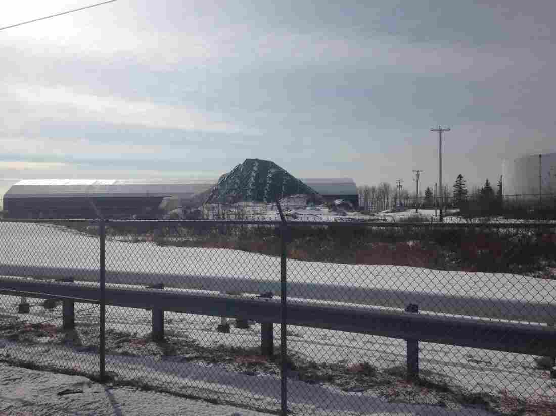 Piles of rock salt at the industrial port in Searsport, Maine, await a barge for transport to New Jersey.
