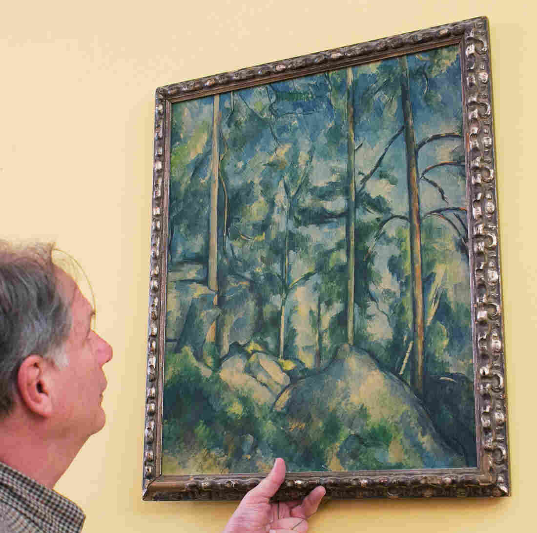 Robert Krulwich grabs a version of Cézanne's Pines and Rocks -- and it reaches for him, too.