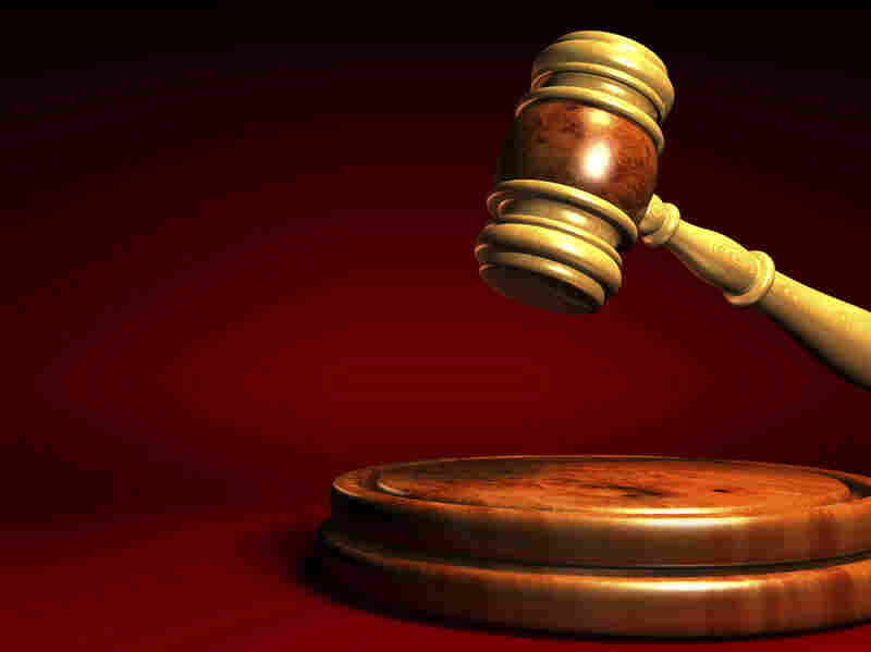 A gavel strikes — perhaps to figuratively call the end of a book auction.